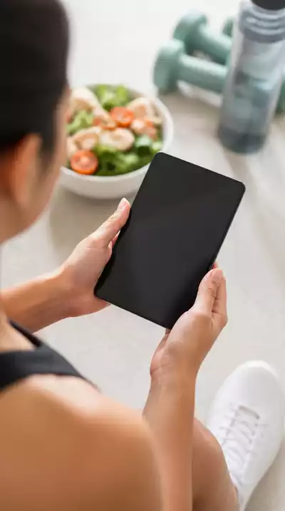Person tracking progress on a fitness app, showing motivation